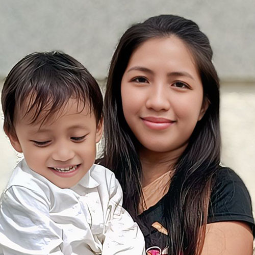 Portrait of Bea Lucas Moral with her child, a BYU-Pathway student from Philipines