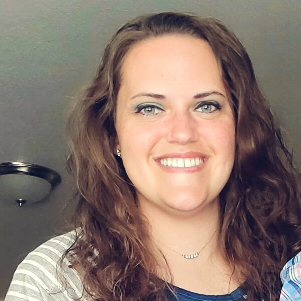 Mindy Ludgate smiling knowing the value of service.