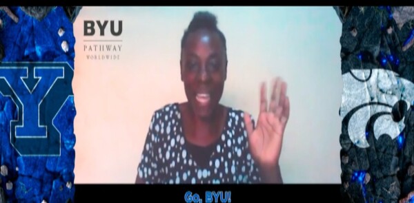 woman waving her hand at the camera during a virtual call