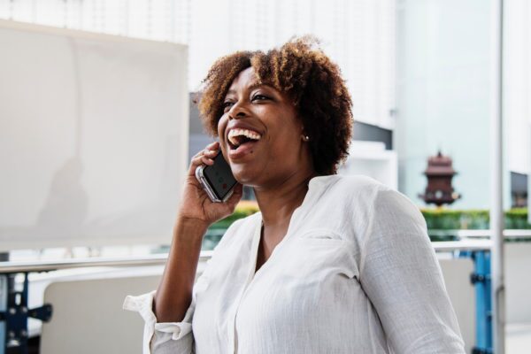 African American woman talks on her cellphone