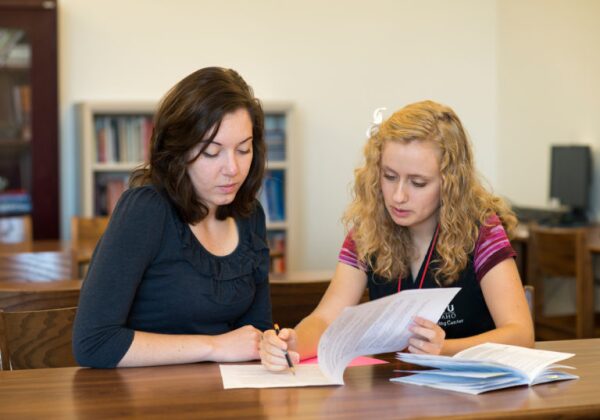 two woman students working together