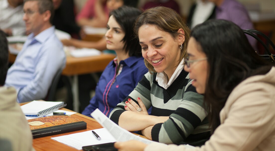 Women talking in class