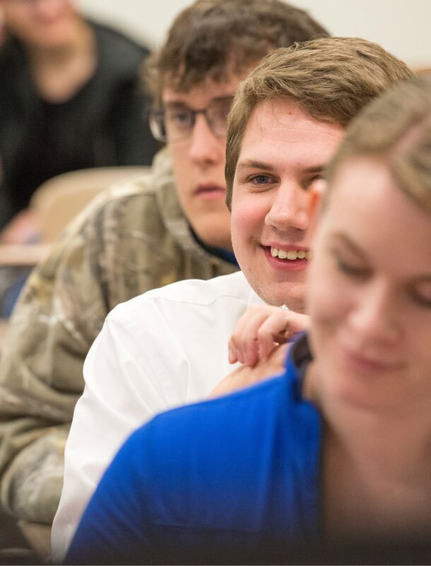 Students sitting in desks in class