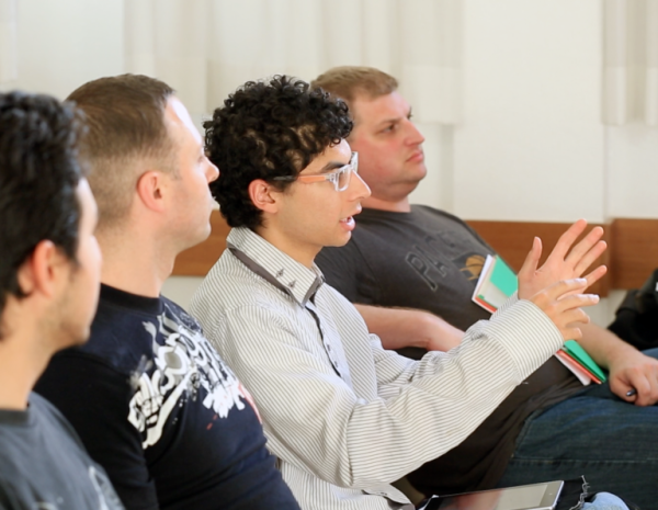 Students in Rome Italy discuss their course at a BYU-Pathway gathering