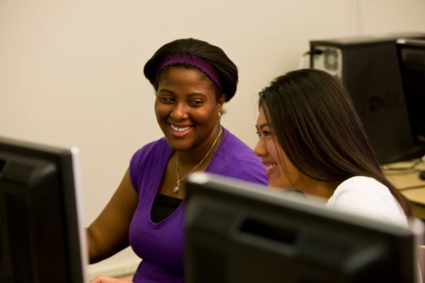 two women family history class students