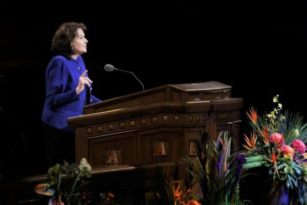 Wendy Nelson speaking at pulpit.