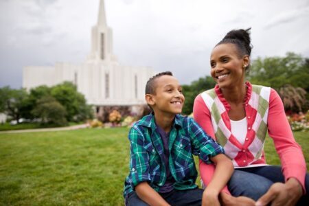 mother and son in front of temple