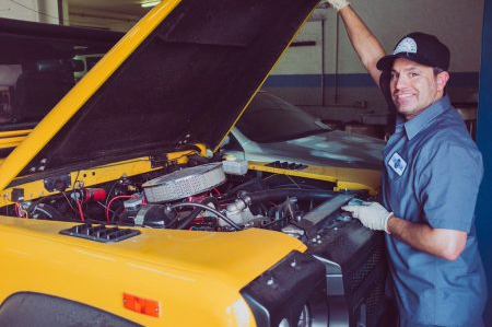 man working on care engine