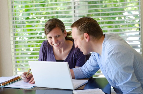 man and woman at computer
