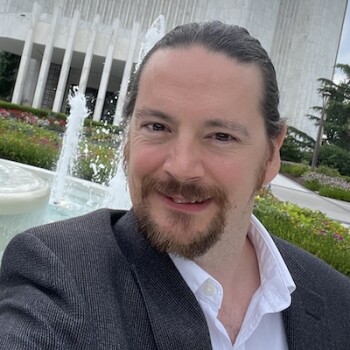 Michael smiles with gratitude for the opportunity to improve himself through education.