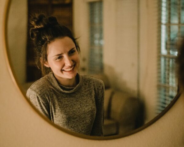 Woman Smiling in the Mirror