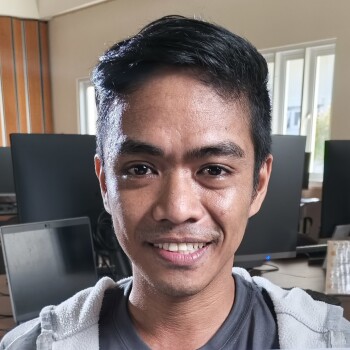 Josua Esoy smiles with gratitude for those who encouraged him to keep pursuing his education.