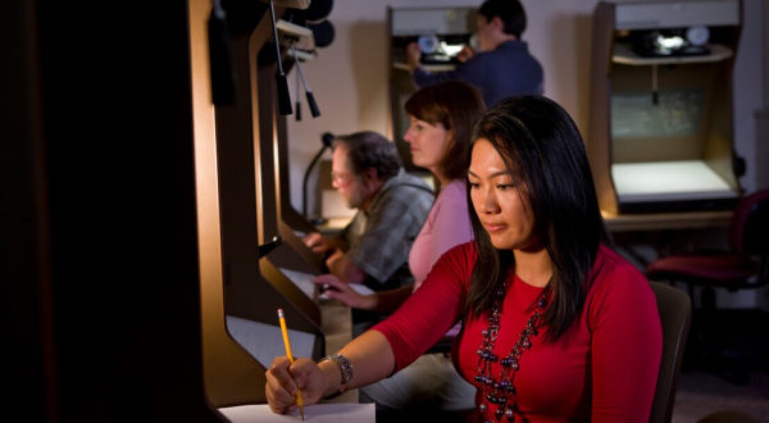 People work in a family history center