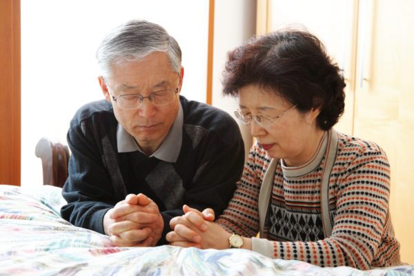 Couples Missionaries Praying