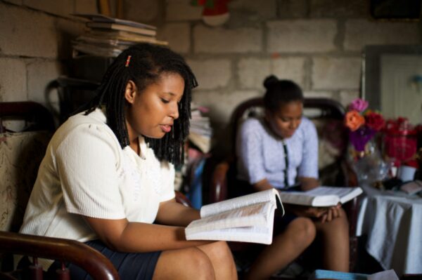 two women reading their scriptures