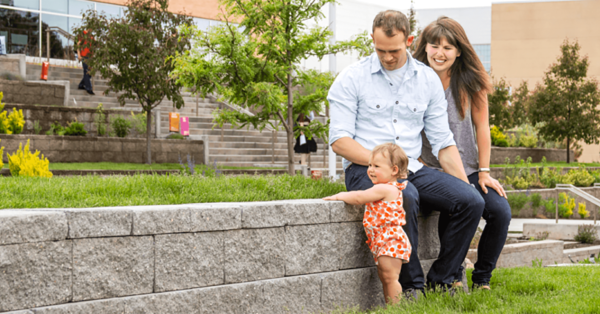 Family_couple_watching_child-1266x662.png