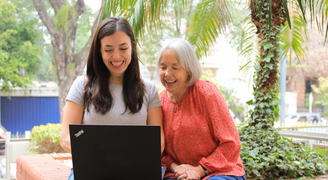 Young woman and her mom looking online, through their laptop computer, at three-year bachelor's degree options offered through BYU-Pathway.